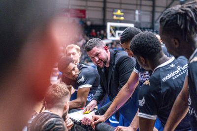 Marc Steutel coach of Newcastle Eagles talking to team on the bench.