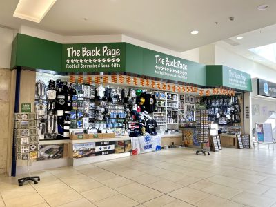 Image of The Back Page stall in Eldon Square with lots of NUFC merchandise on the walls.