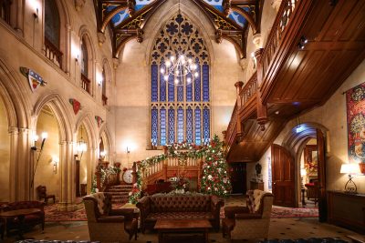 A grand hall decorated for Christmas