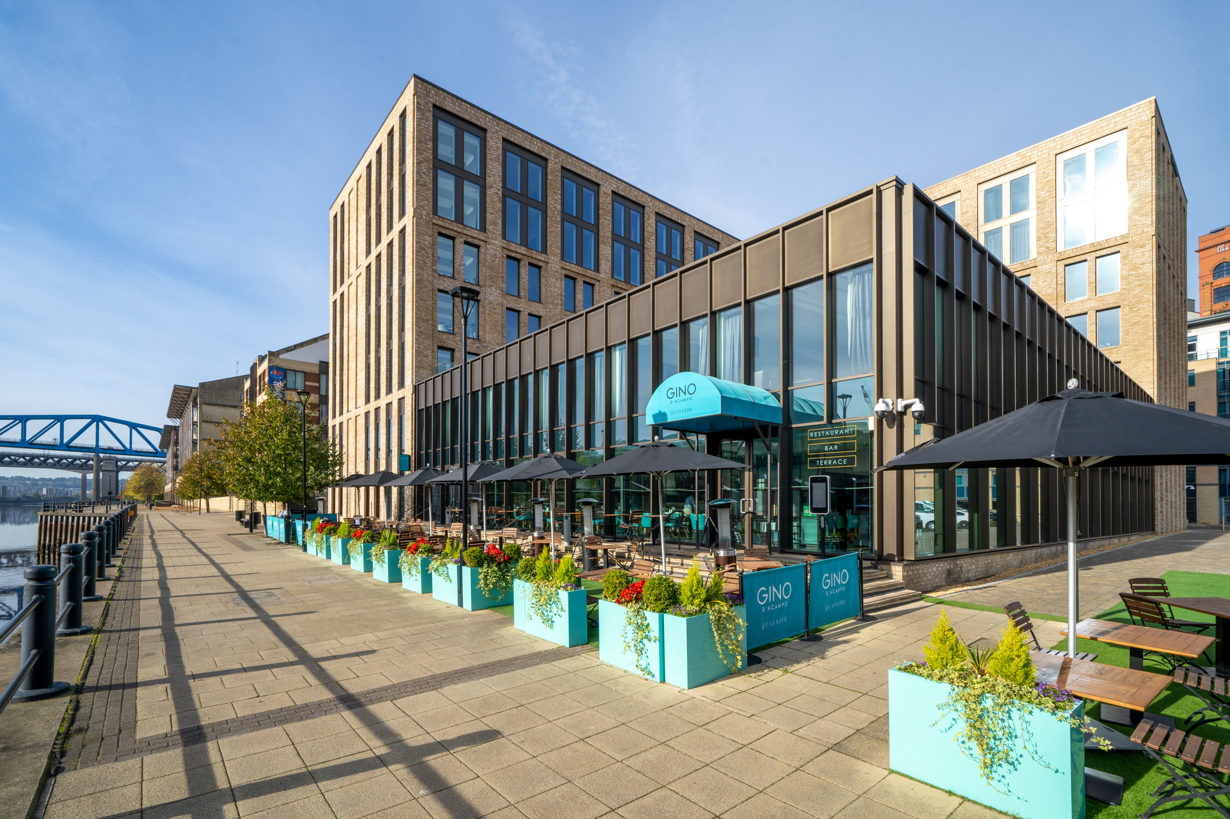 Image of the outside of the INNSIDE by Melia hotel on Newcastle Quayside in the bright sunshine.